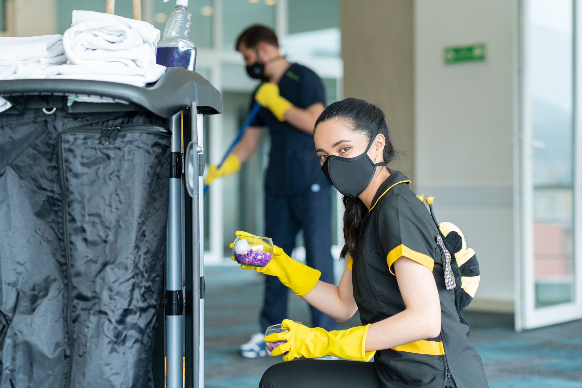 Cleaning staff is cleaning the building to avoid the risk of contagion by COVID-19